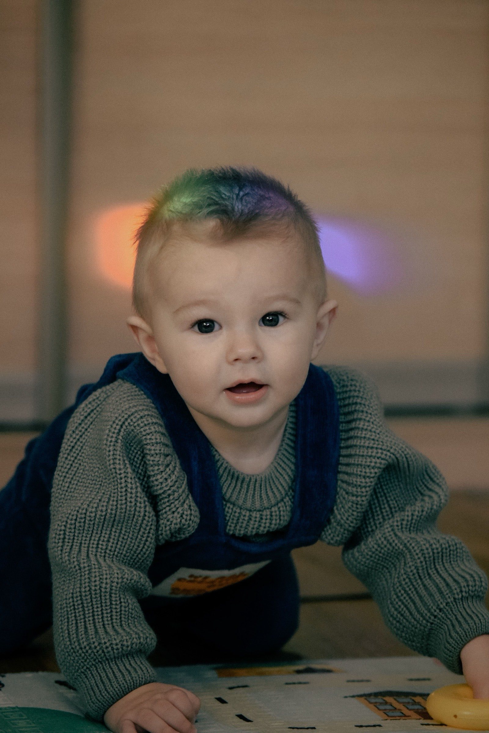 A baby crawling and exploring during play